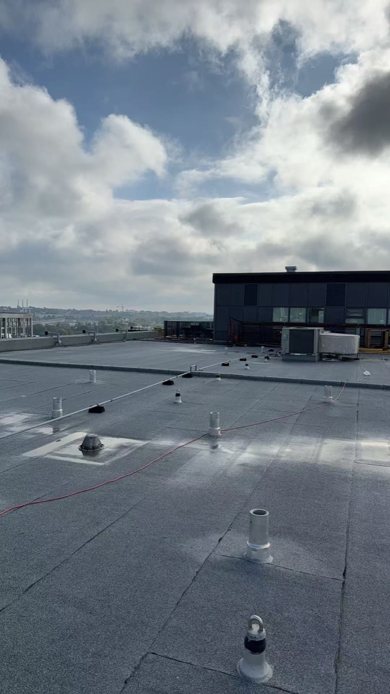 Completed flat roofing membrane and roof penetrations on the Halifax property