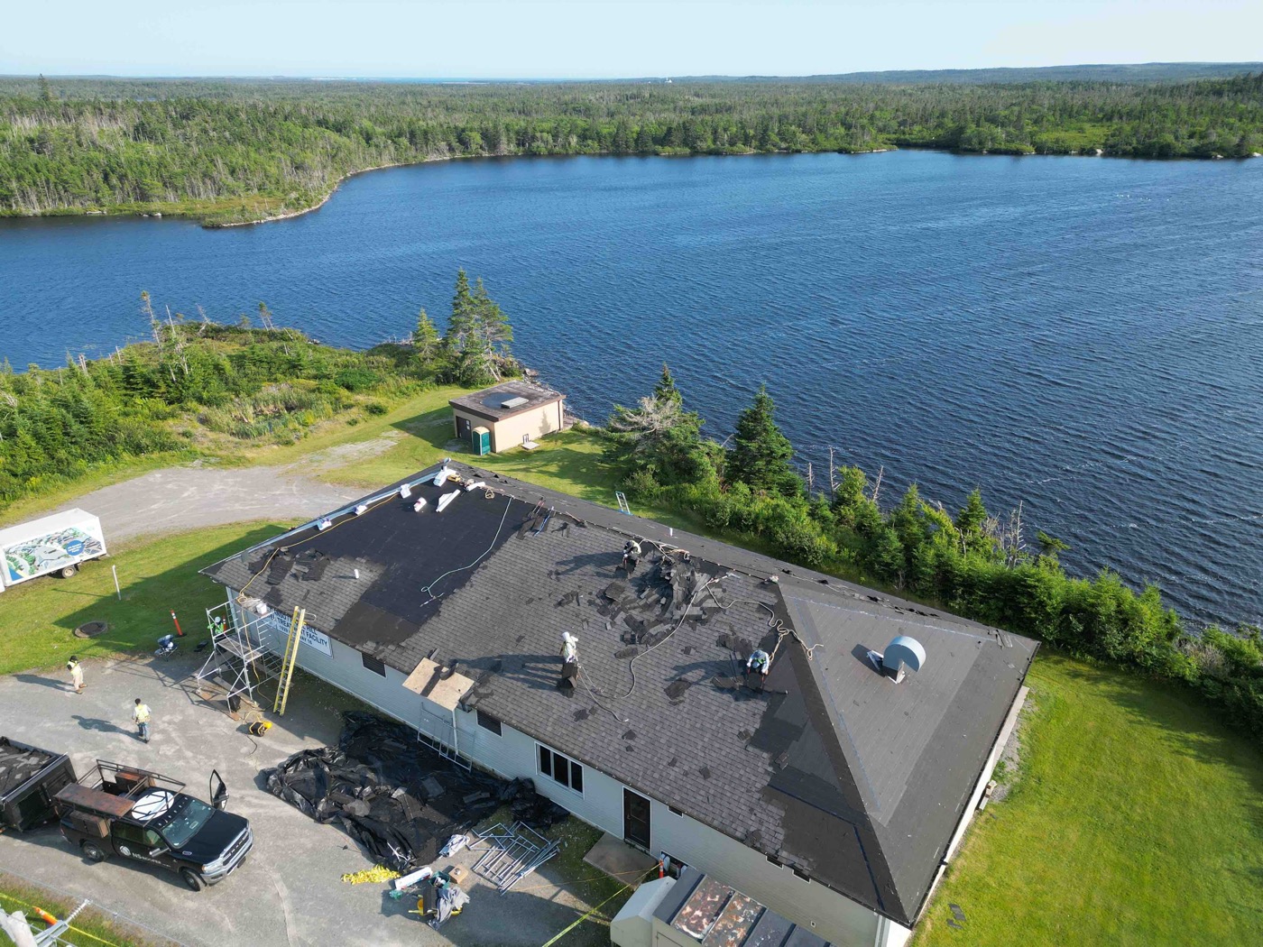 Aerial view of shingle removal and roof preparation in Guysborough