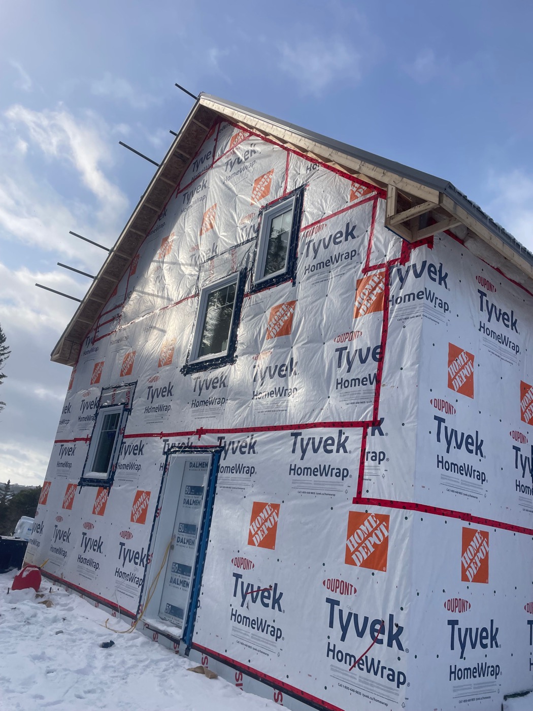 Detailed weather-barrier installation on the coastal builder project