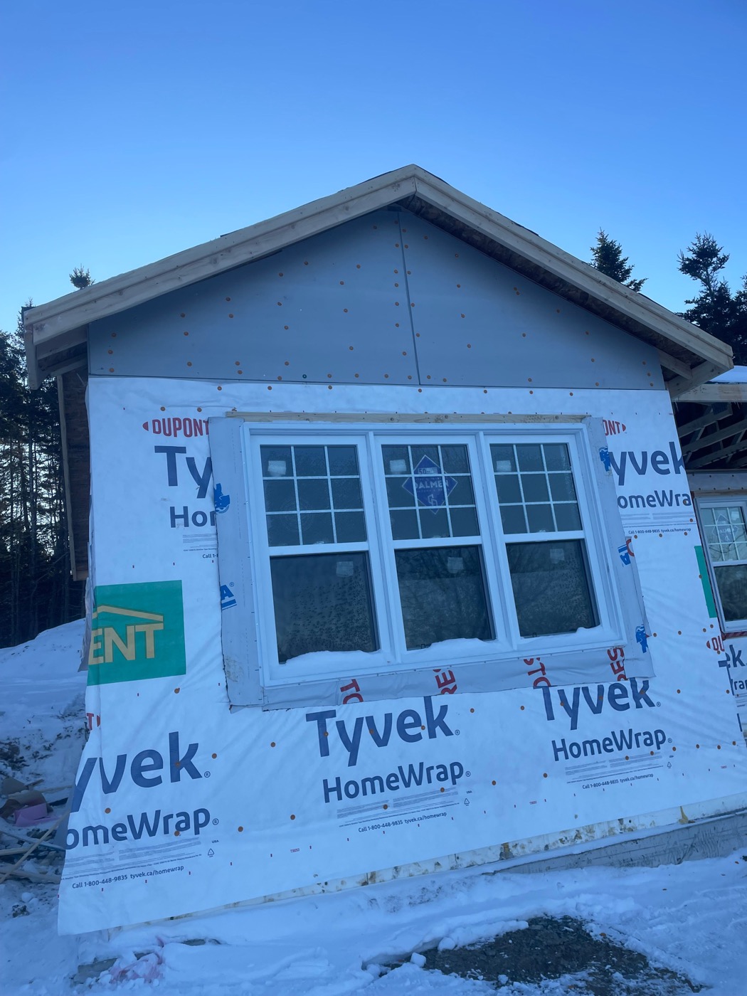 Exterior insulation and window detailing during siding preparation