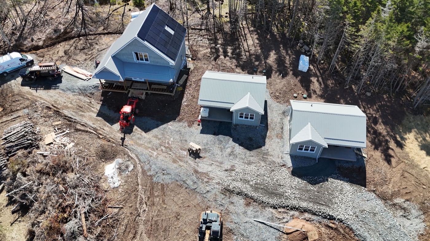 Aerial view of the completed siding and roofing systems across the builder project